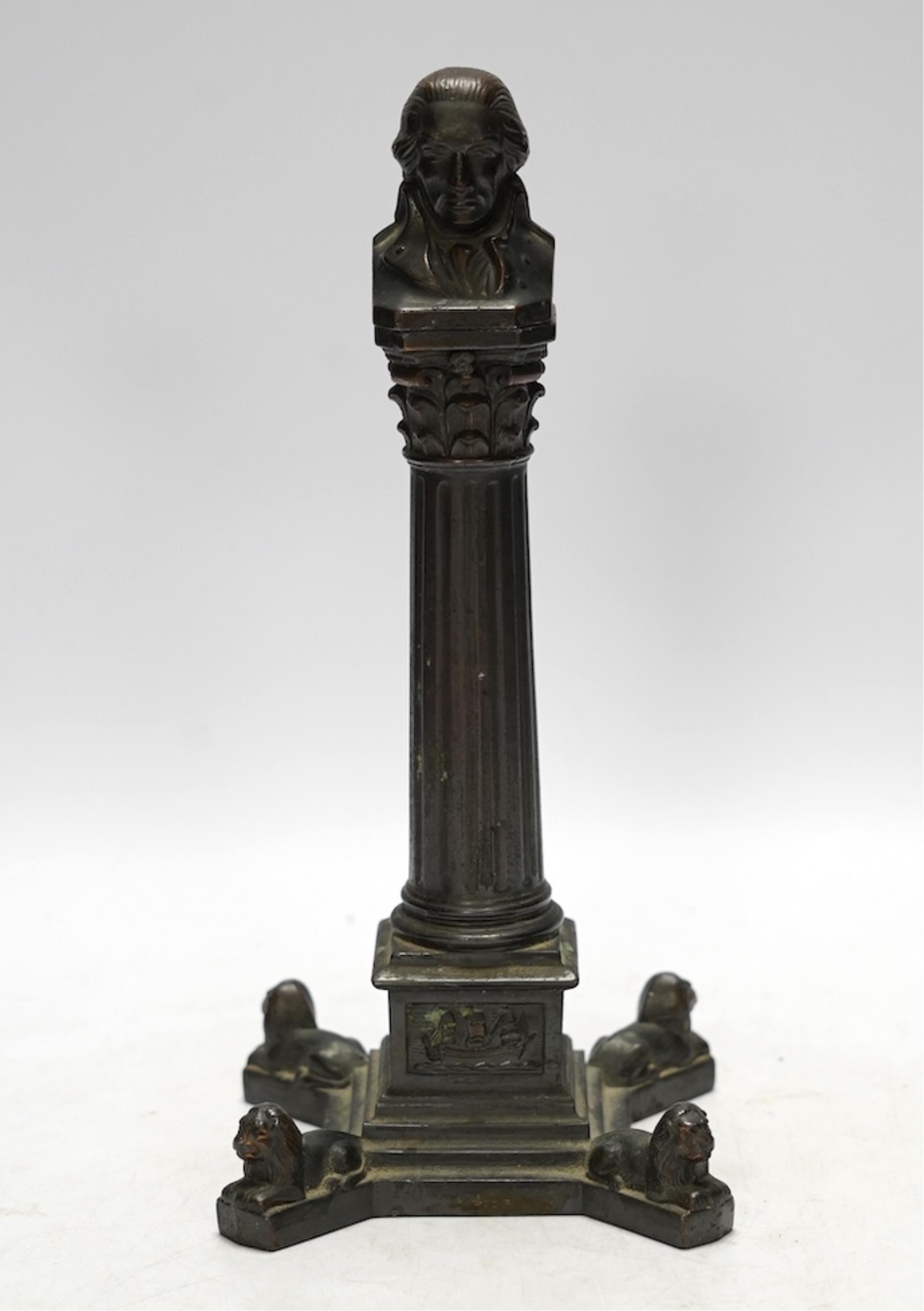 A spelter bust of Lord Nelson on a column table lighter, 25cm high. Condition - poor to fair, hinge broken, untested